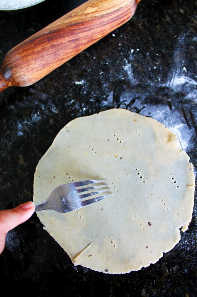 using a fork, poke some holes in the pakwan 