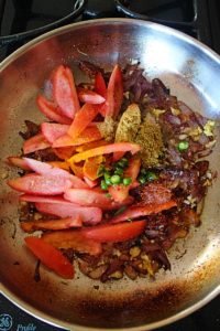 add tomatoes and spices and cook