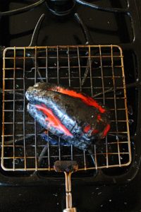 roasting red pepper for baingan bharta