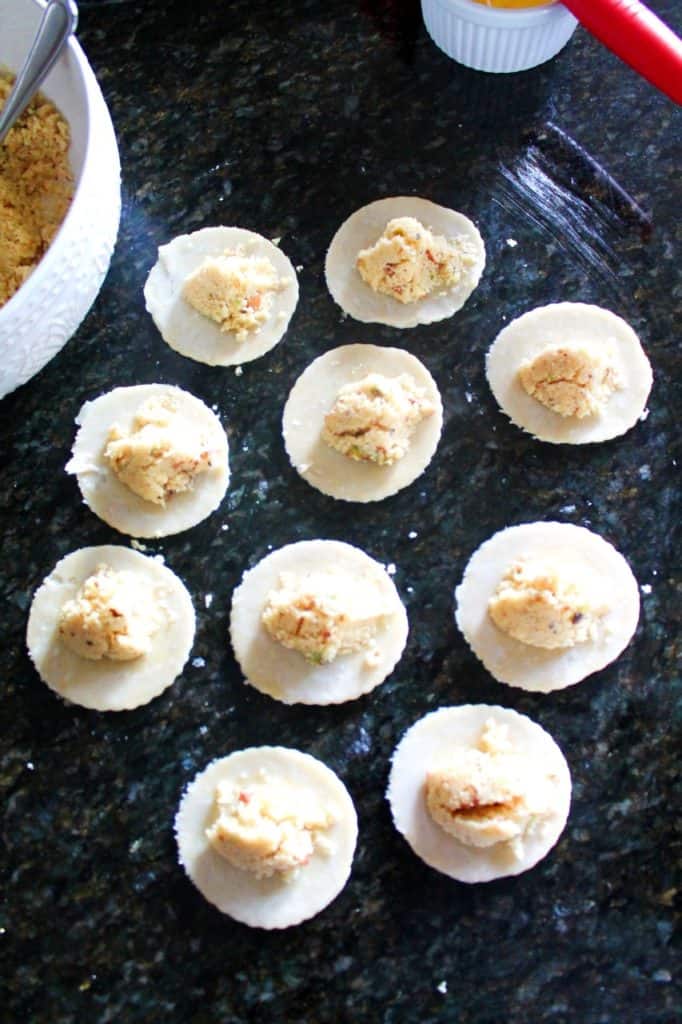 add gujiya filling in the center of the dough