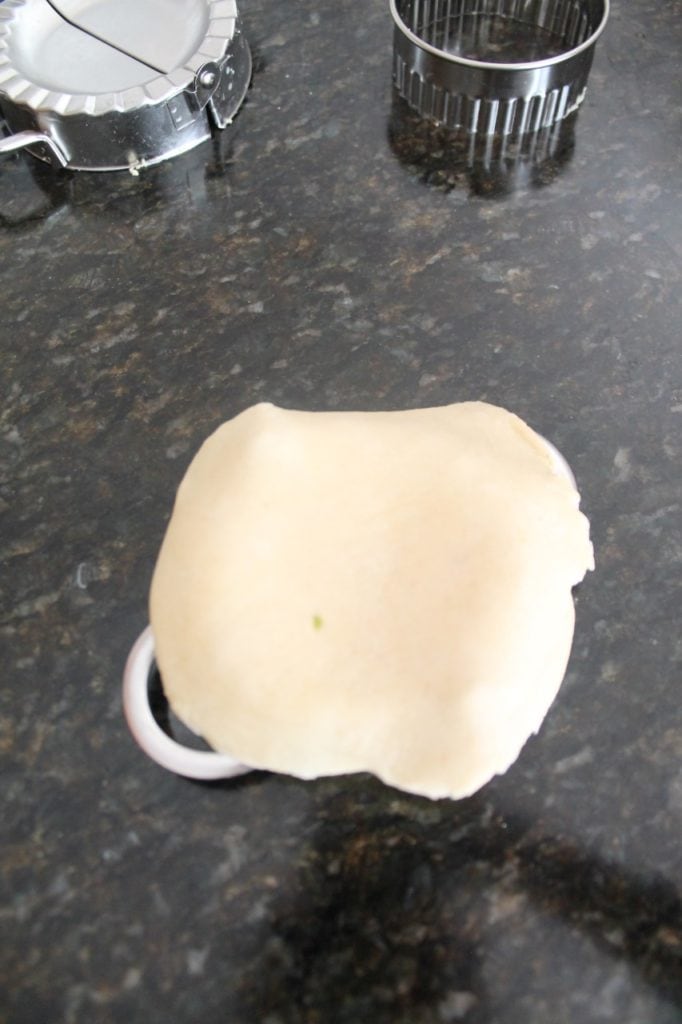 place the rolled dough on gujiya mold