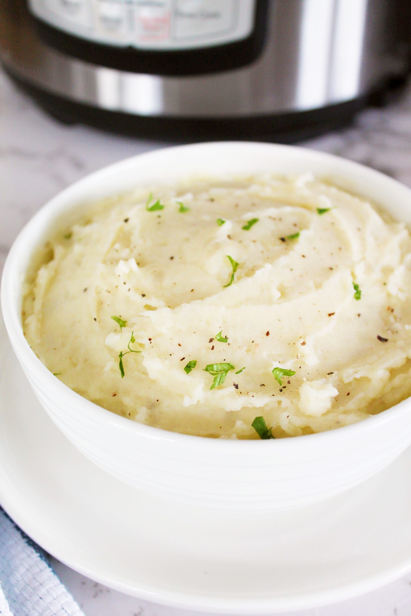 instant pot mashed potatoes with butter and freshly ground black pepper