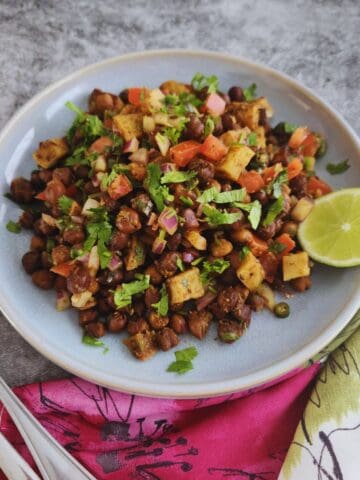 warm kala chana chaat served with a squeeze of fresh lemon juice
