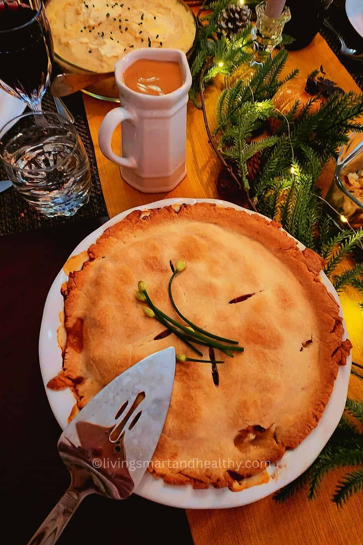 Comfort food classic: baked chicken pot pie with carrots, peas, and mushrooms.