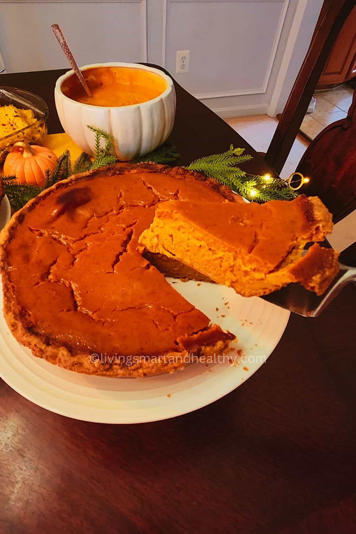 Slice of creamy pumpkin pie with whipped cream, a must-try pumpkin pie recipe for Thanksgiving desserts.