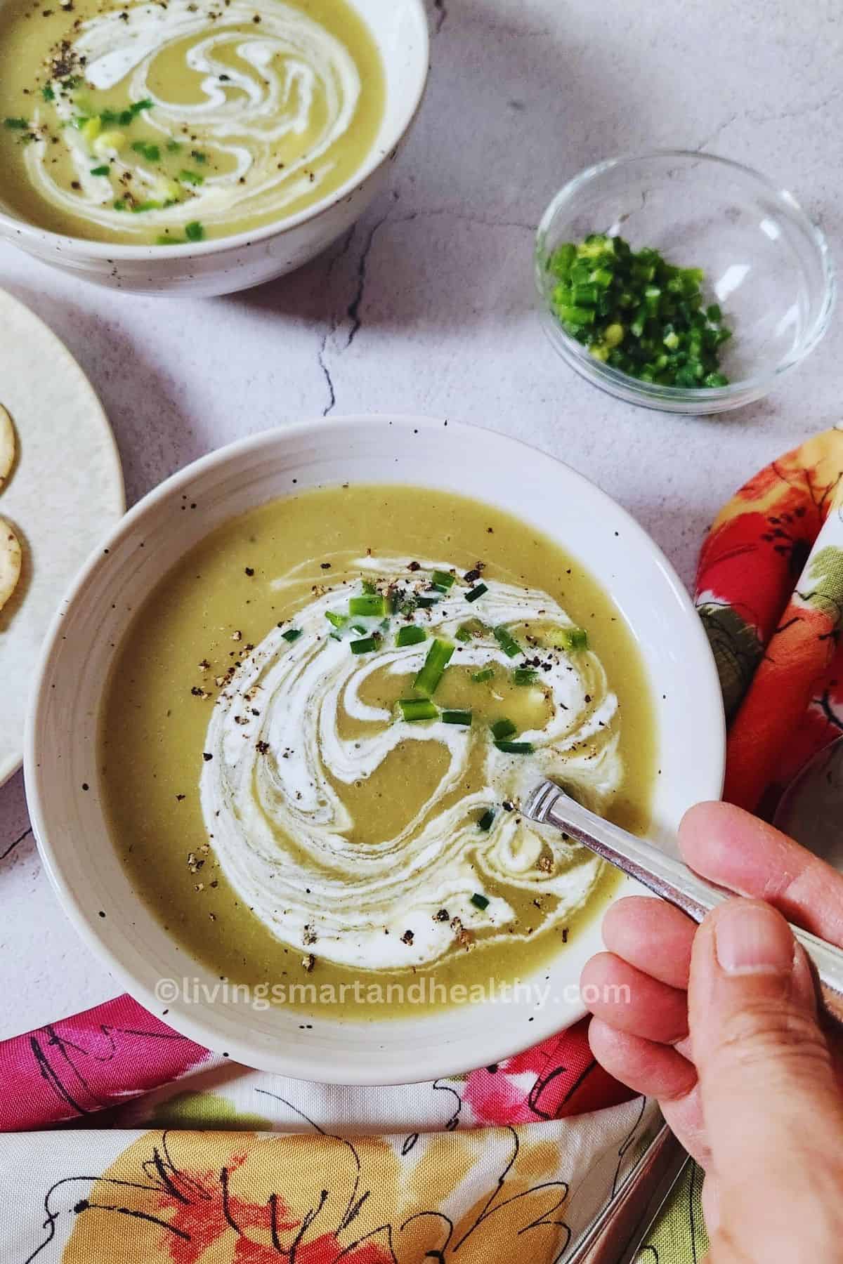 low carb, High protein keto-friendly creamy celery soup garnished with cream