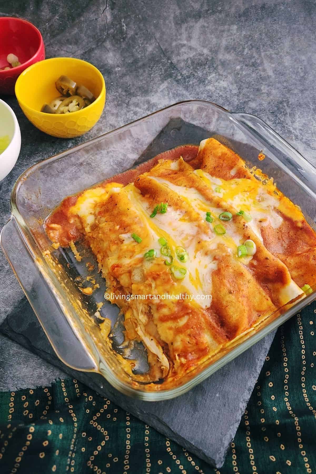 Healthy keto-friendly chicken enchiladas baked with cheese