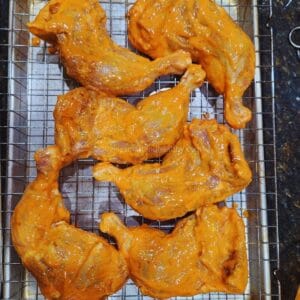 tandoori chicken cooking in a oven