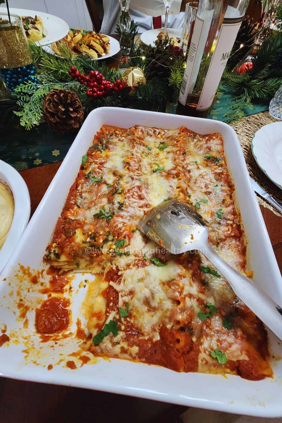 Slice of eggless spinach lasagna on a plate showing noodles and spinach filling