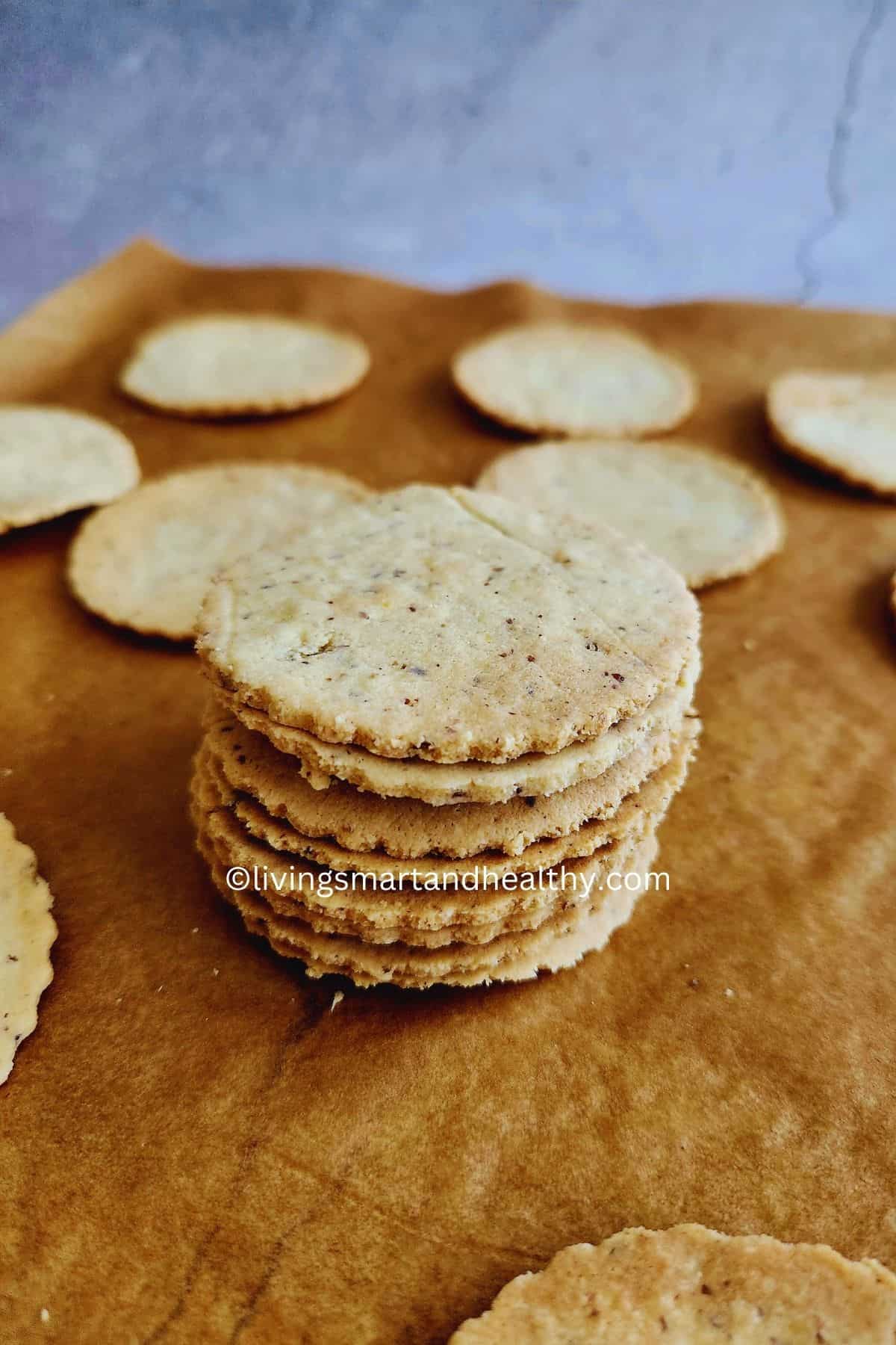 Homemade low-carb almond flour crackers cooling on a baking tray