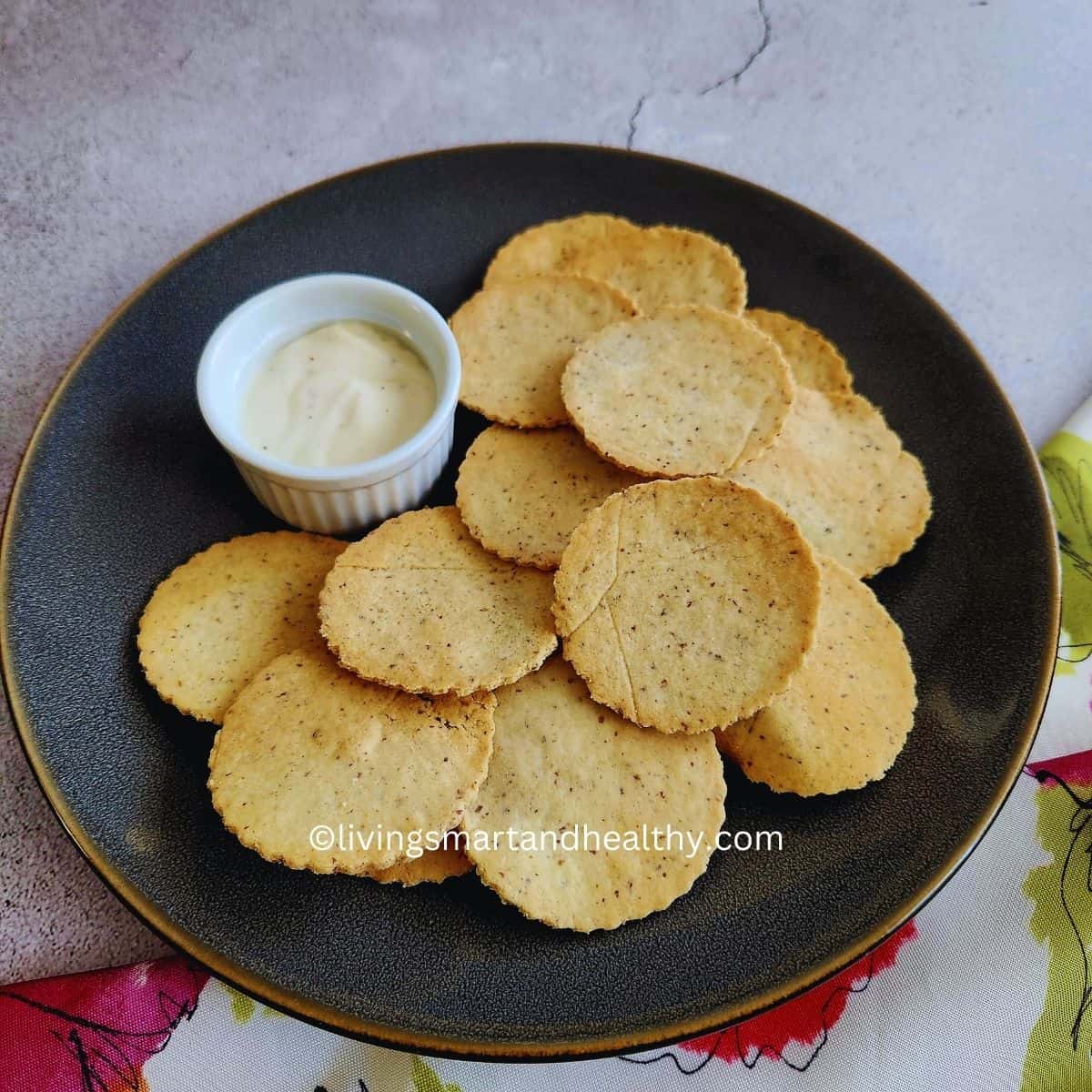 homemade almond flour crackers with dip on a serving platter