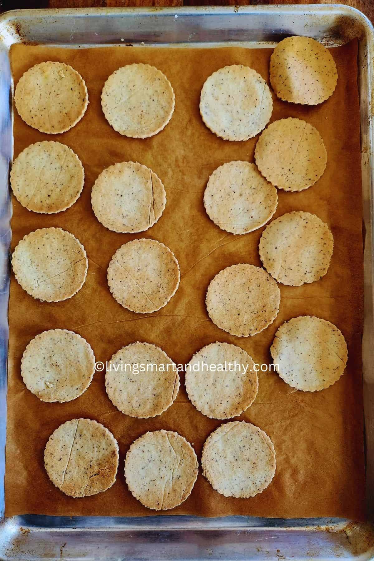 almond flour crackers baked to crisp perfection, arranged on a parchment sheet