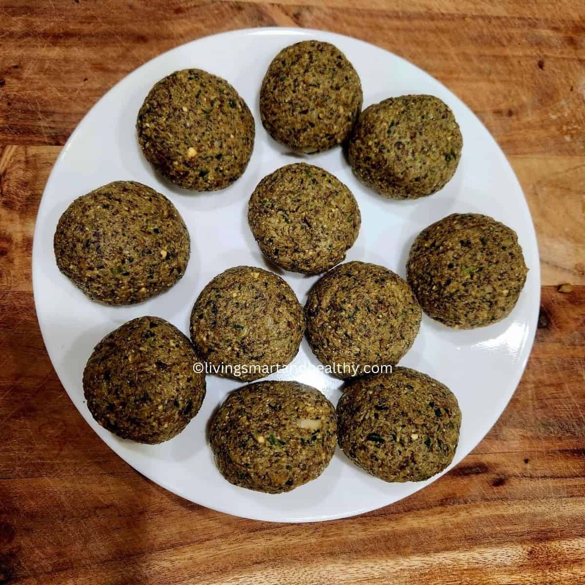 Shaping mushroom galouti kebabs into small, round patties ready to cook
