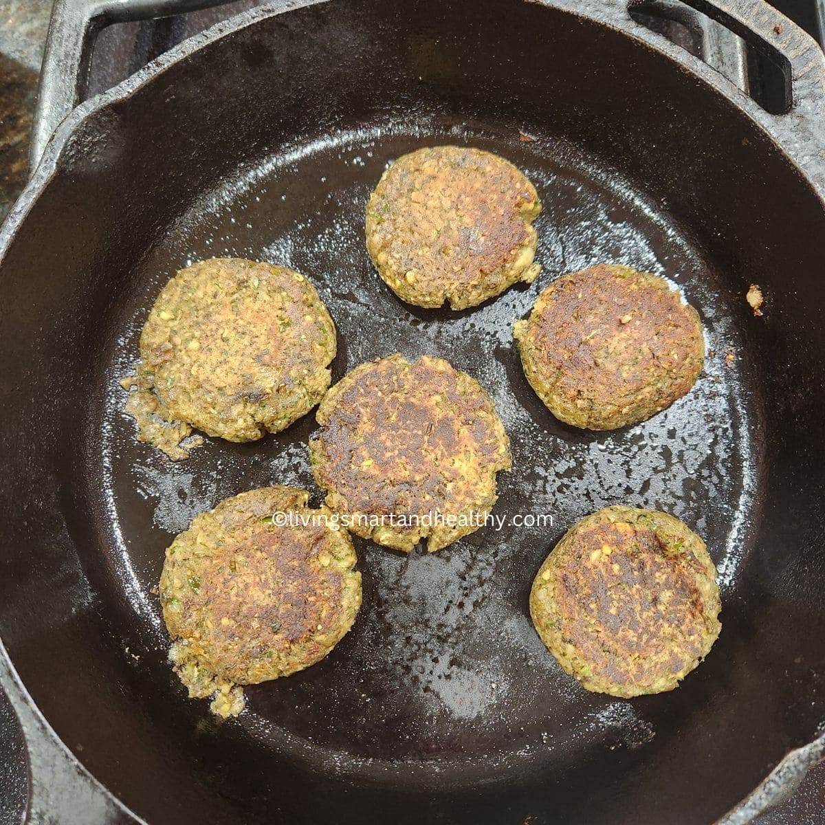 veg galouti kabab patties on cast iron skillet