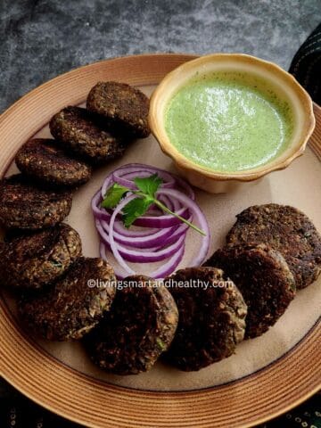 Serving mushroom galouti kebabs on a platter with mint yogurt sauce