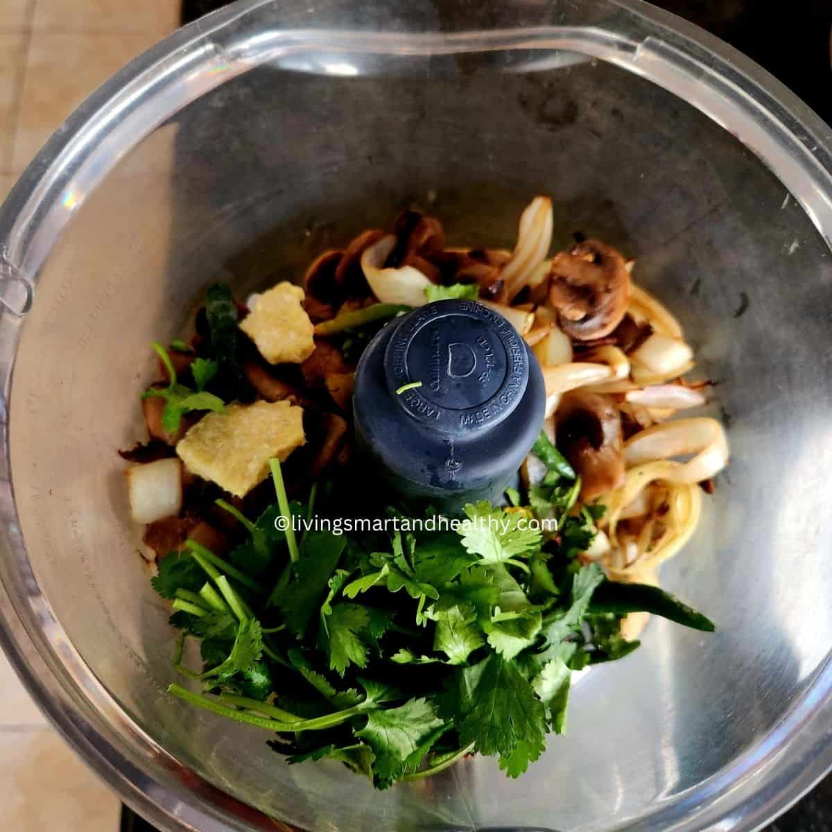 Blending mushrooms, onions, herbs, spices, and roasted chana dal into a smooth kebab mixture
