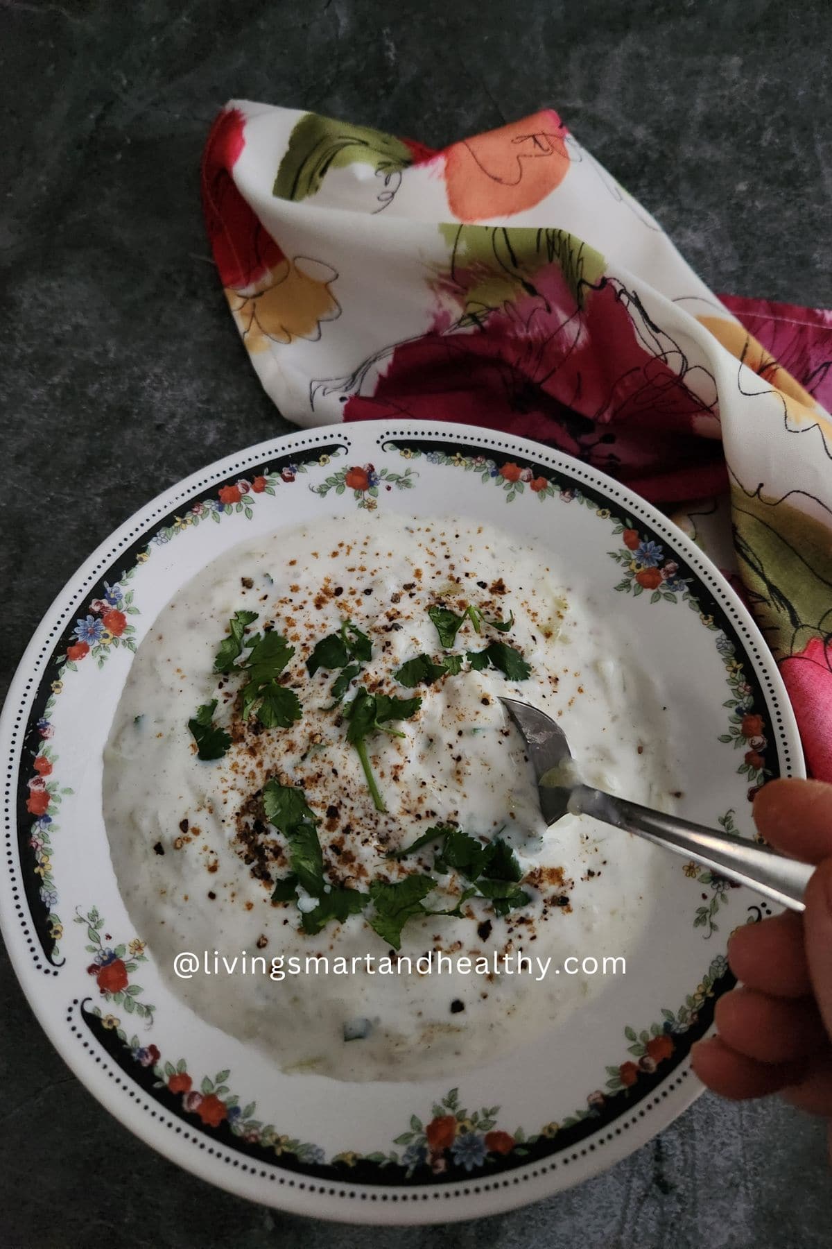 Ghee sautéed grated lauki being mixed into fresh yogurt for raita
