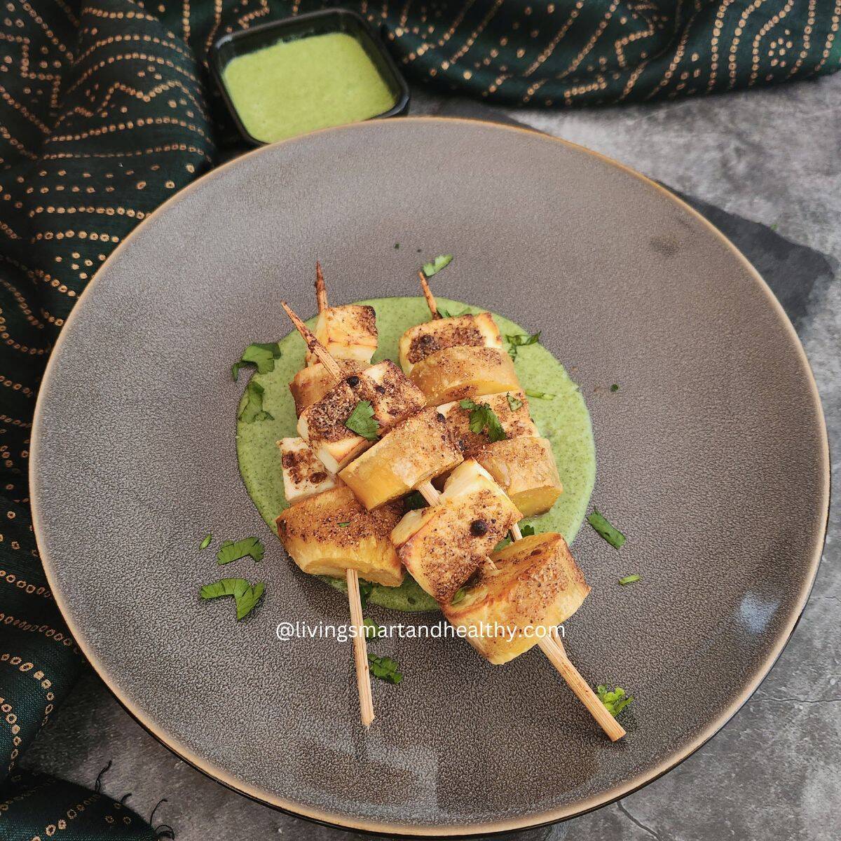 Crispy paneer and sweet potato skewers served with vrat green chutney