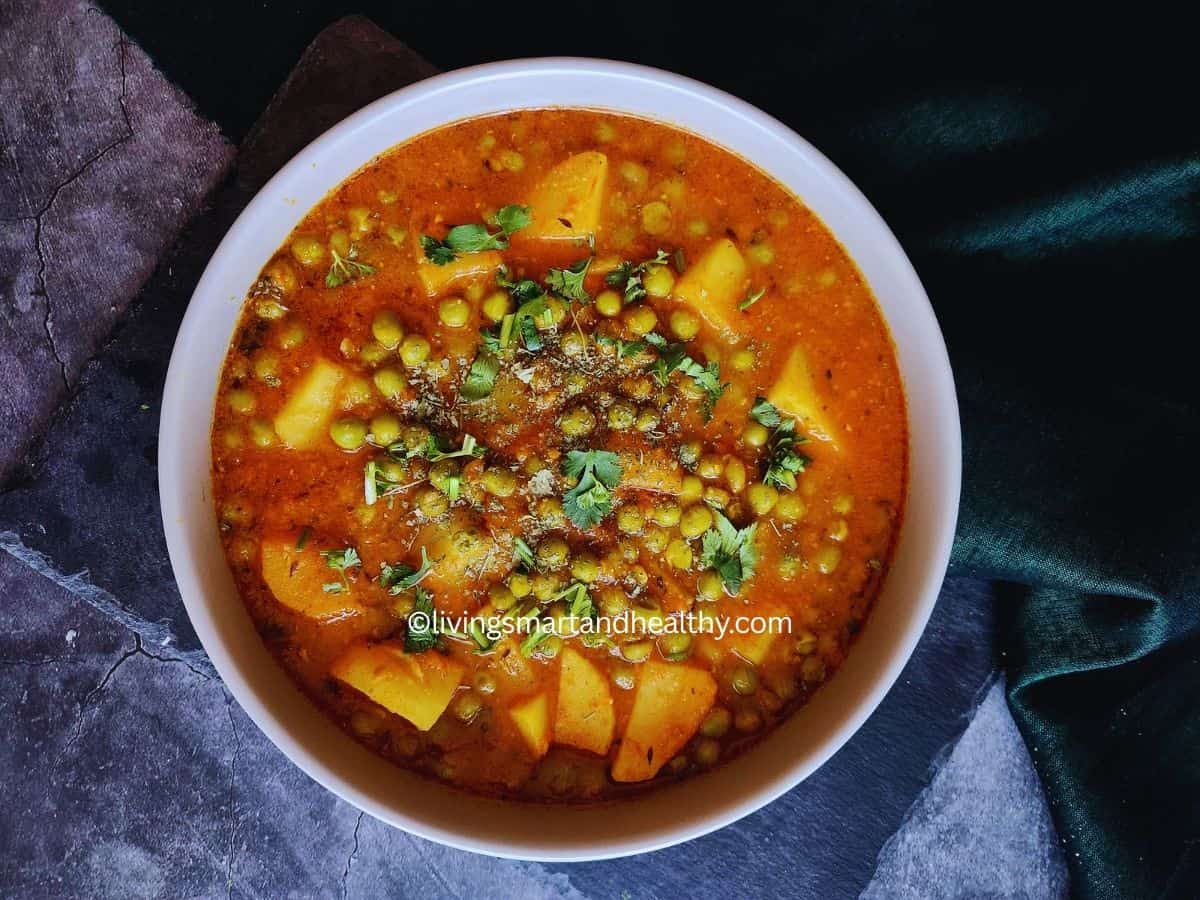 Homestyle aloo matar with tomato gravy and cilantro garnish