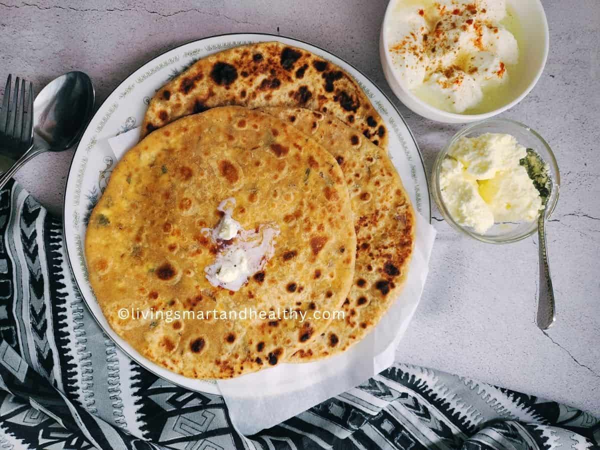 aloo paratha served with butter and yogurt