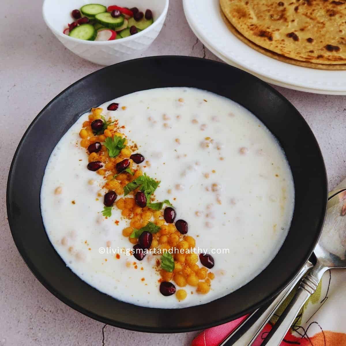 Close-up of dahi boondi raita with soft boondi in spiced yogurt