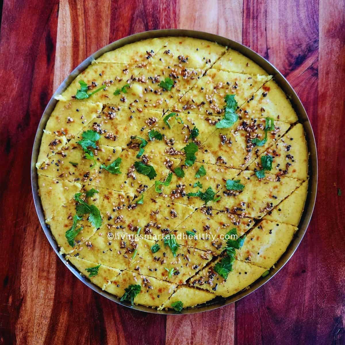 instant dalia dhokla garnished with coriander