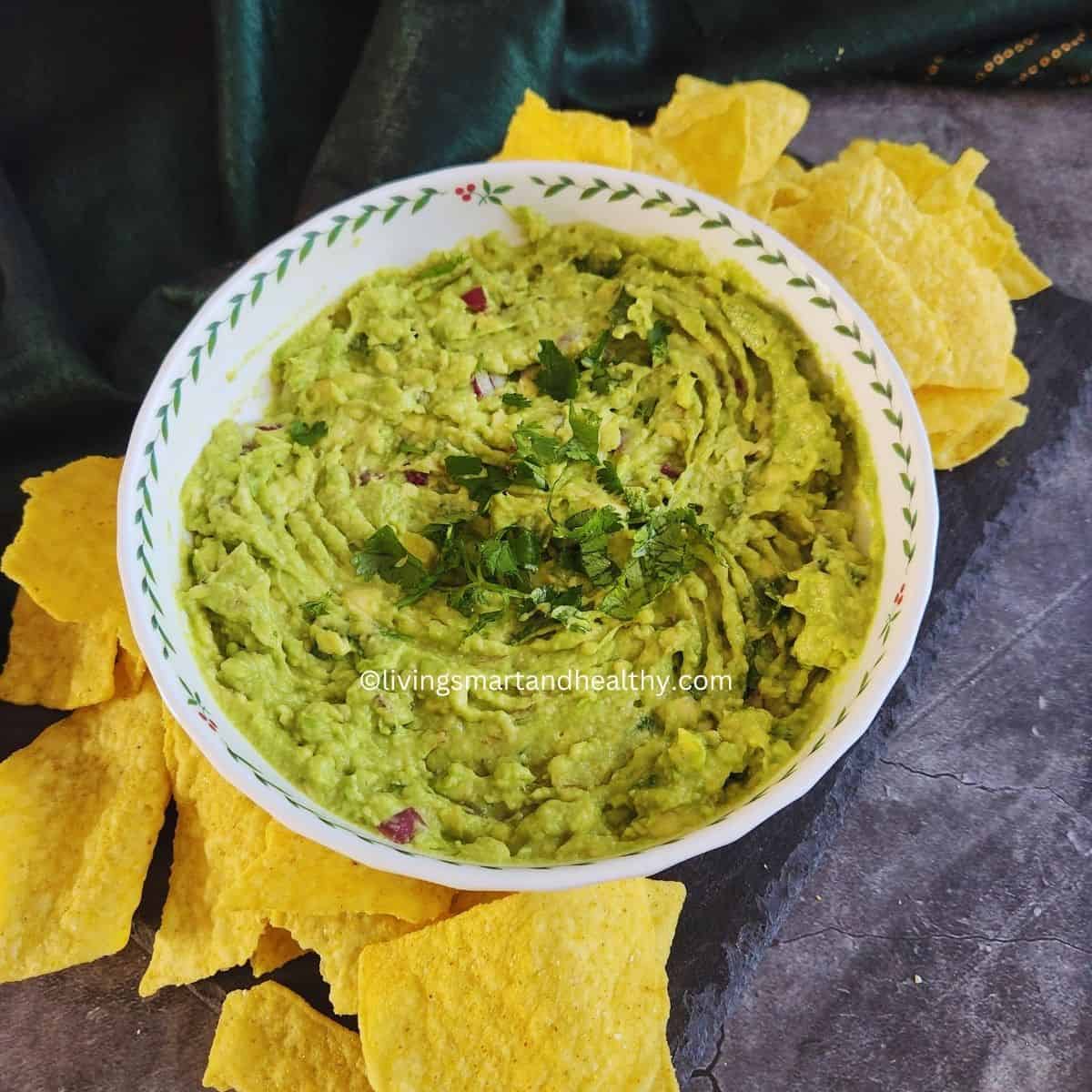 Finished guacamole dip ready to serve with tortilla chips