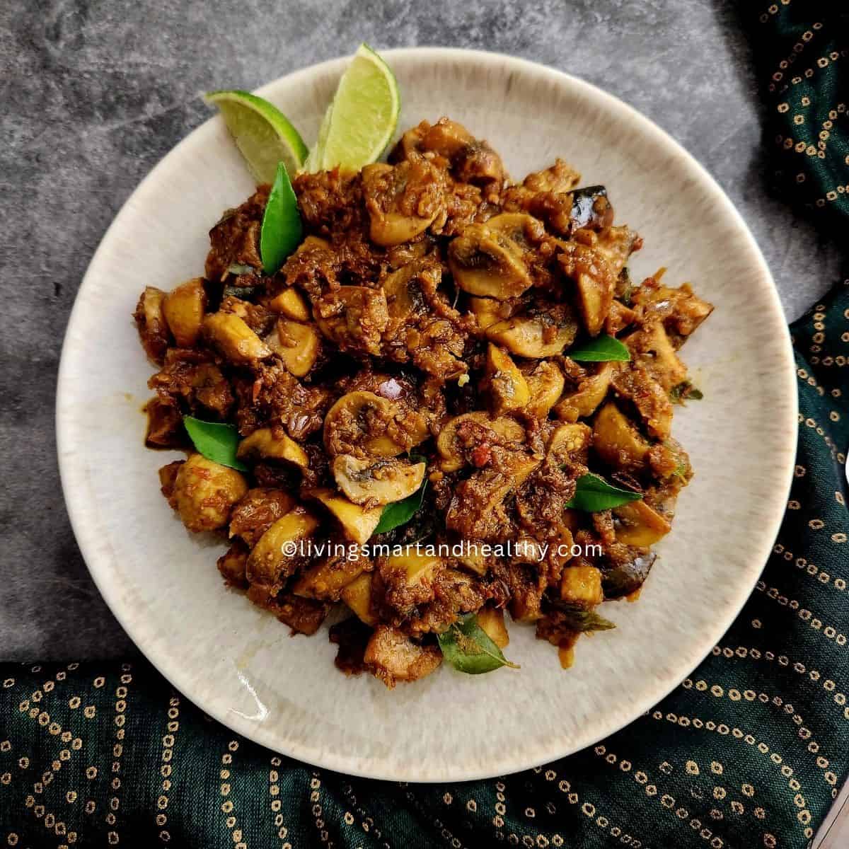 Mushroom pepper fry served with steamed rice and rasam on a banana leaf plate