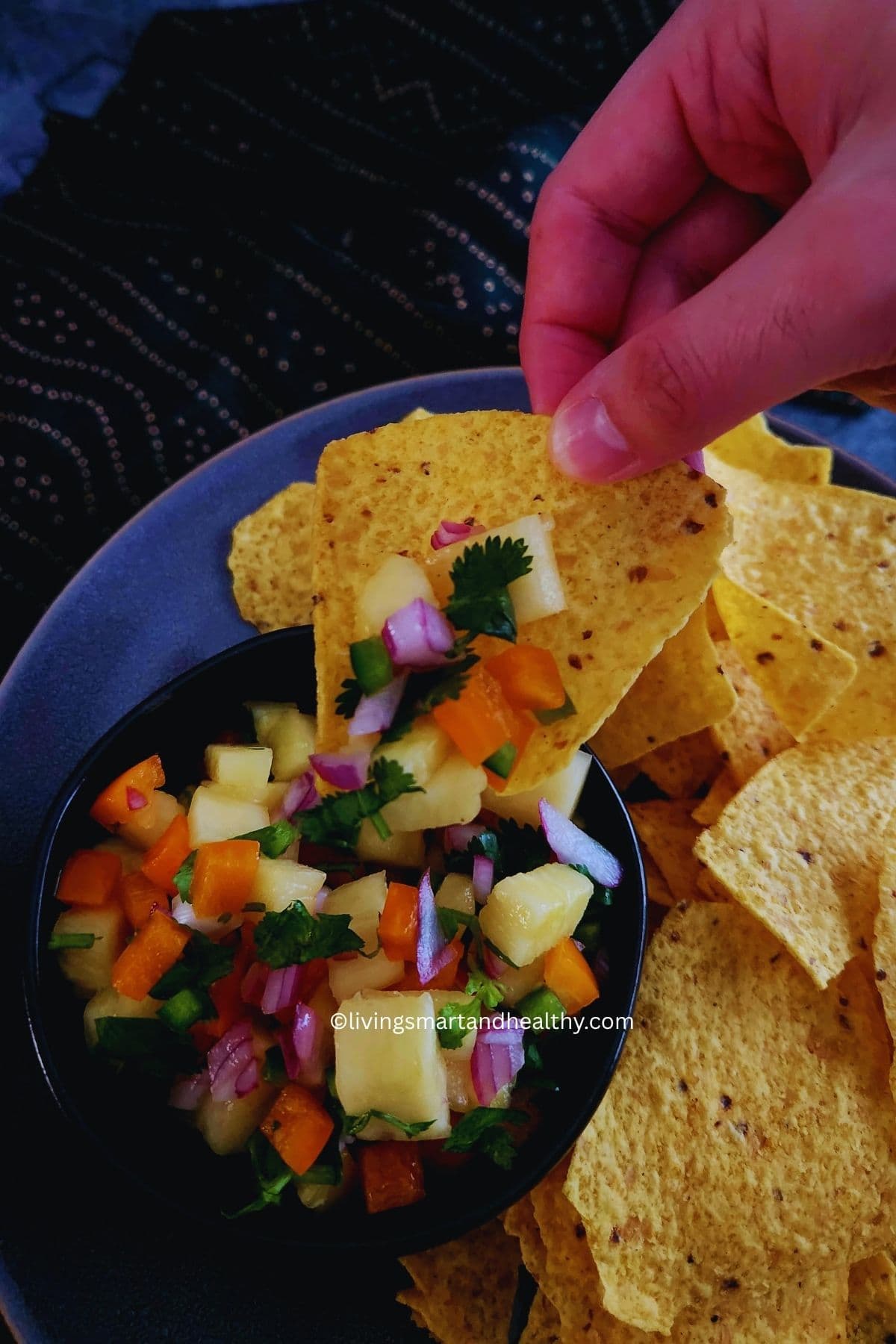 Close-up of homemade pineapple salsa with cilantro and lime
