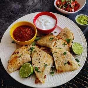 low carb Chicken and roasted poblano quesadilla served with yogurt dip, salsa and gucamole