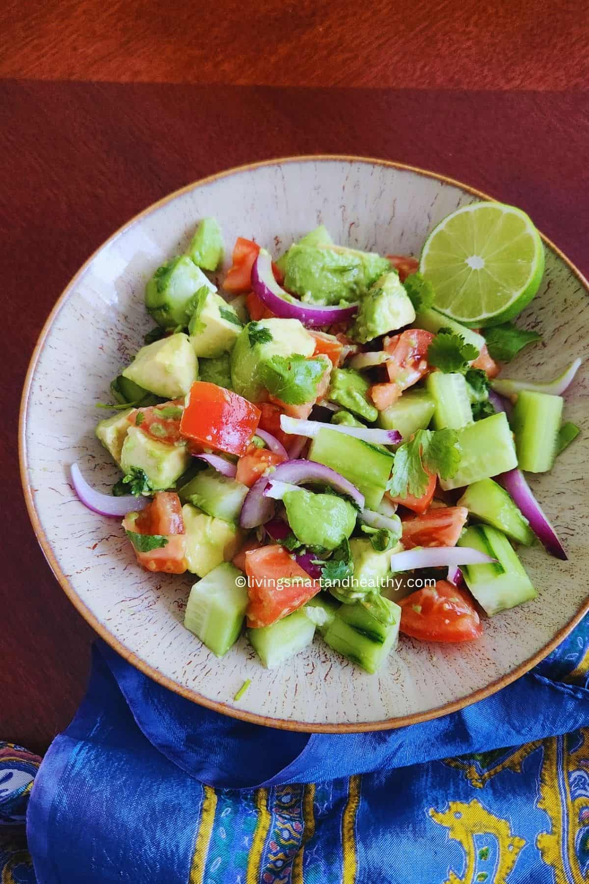 healthy Indian salad with avocado and lime
