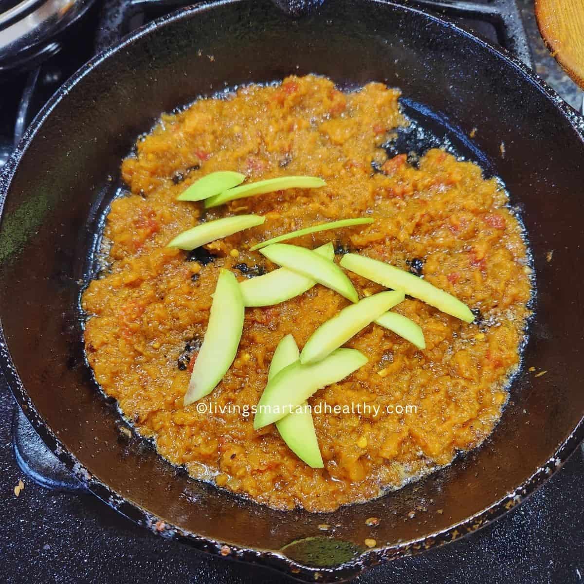 bhuna masala for bhindi do pyaza, with seasonal touch raw mango slices
