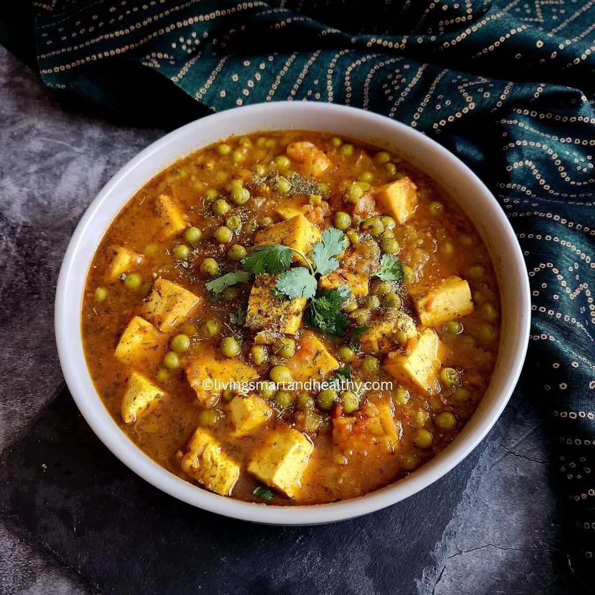 vegan matar paneer with tofu garnished with kasuri methi and fresh cilantro