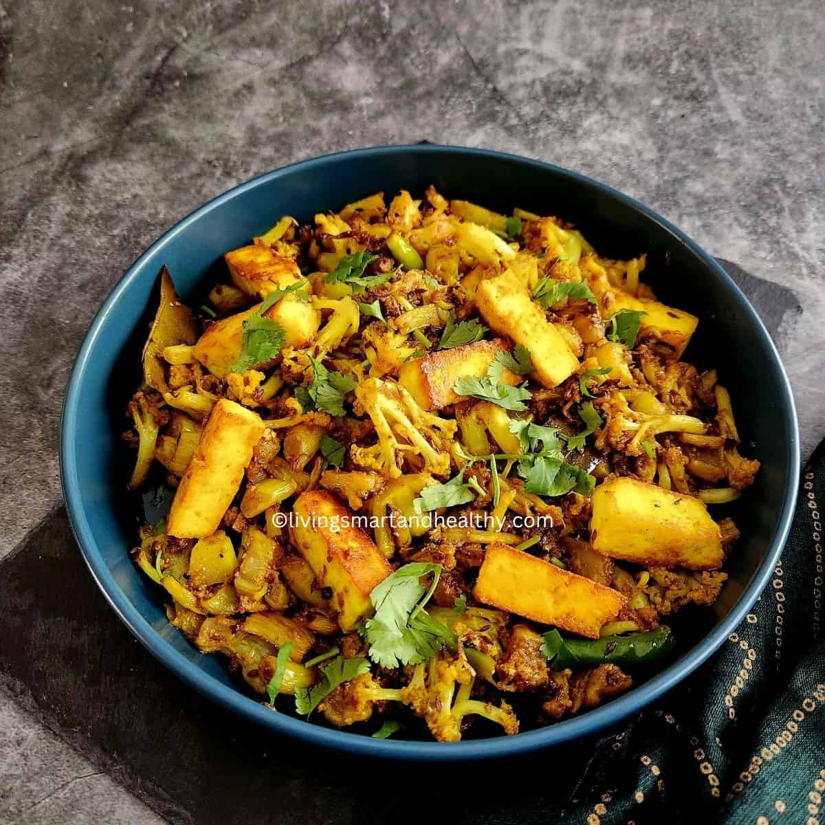 Gobi paneer stir fry with crispy cauliflower and pan-fried paneer cubes in aromatic spices