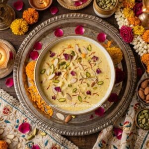 Creamy paneer kheer in a white bowl garnished with pistachios and saffron