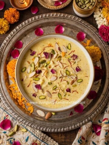 Creamy paneer kheer in a white bowl garnished with pistachios and saffron