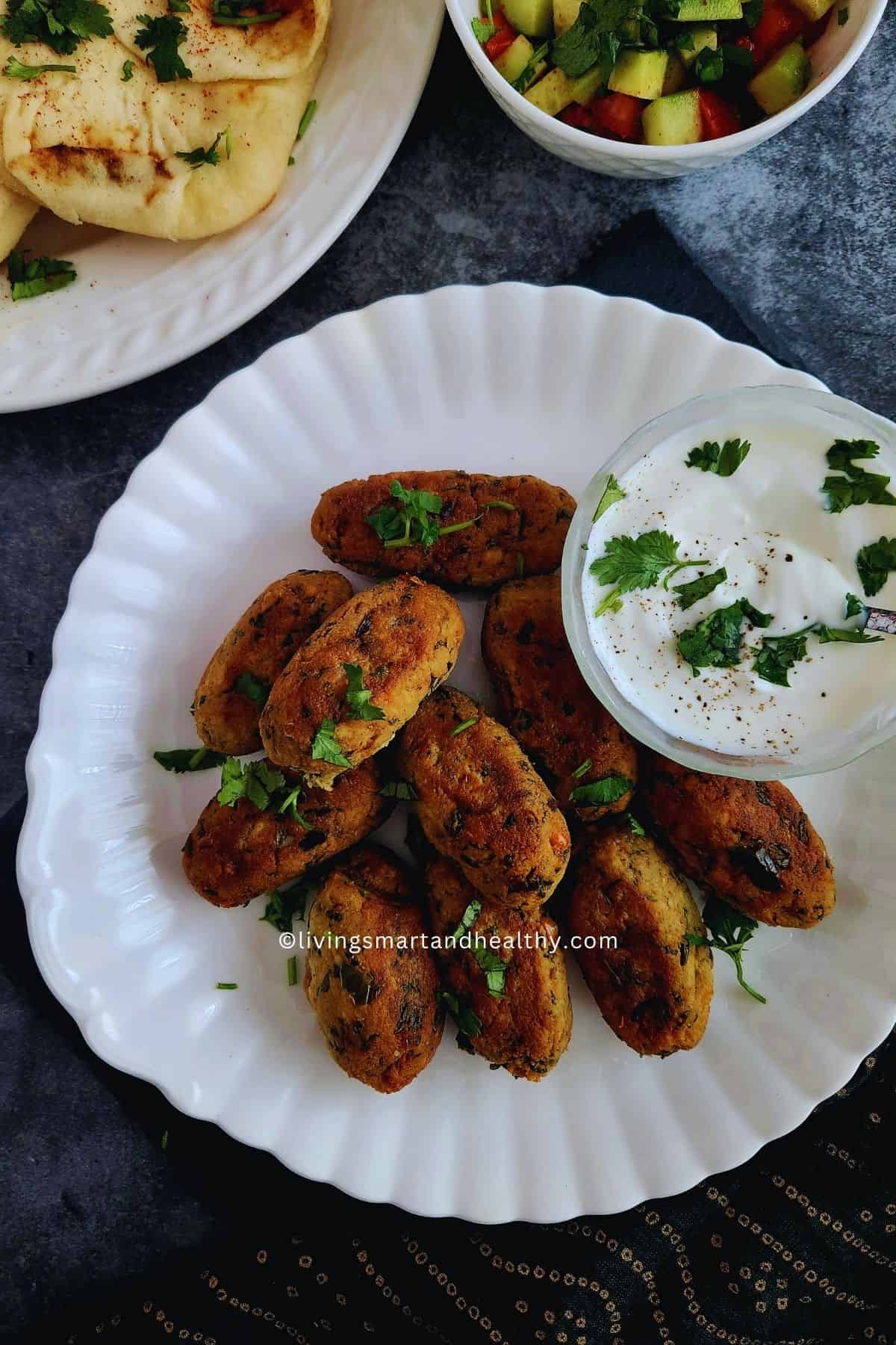 Tofu kebab served with mint chutney, onion rings, and chaat masala
